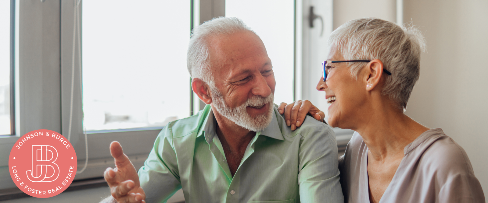 older couple laughing and looking at each other