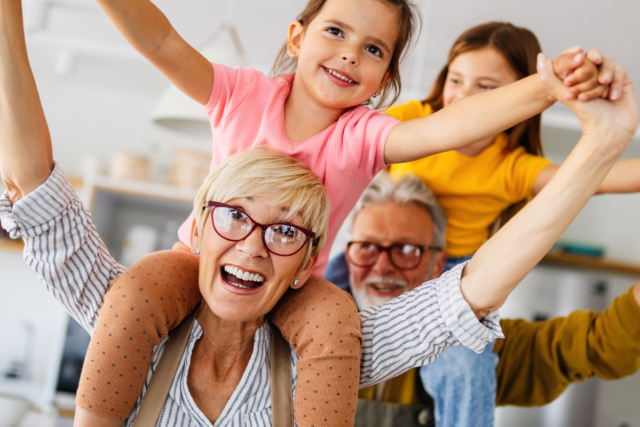 Grandparents playing with grandkids
